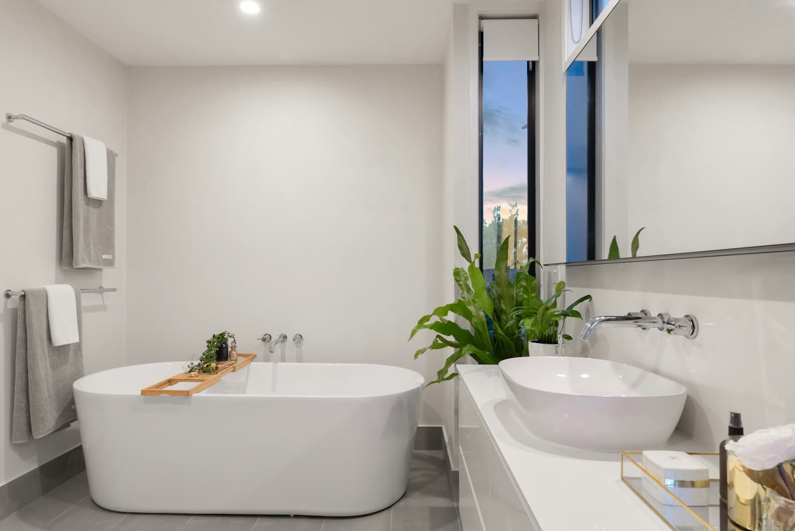 Modern tiled bathroom with freestanding bath